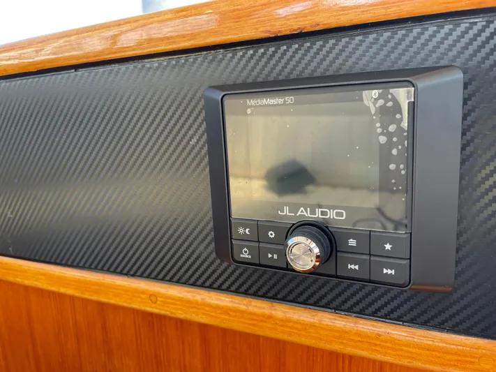 Bushwacker Yacht Photos Pics JL Audio system on 1972 Bertram 31 Sedan Hardtop Cruiser dashboard.
