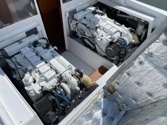 Bushwacker Yacht Photos Pics 1972 Bertram 31 Sedan Hardtop Cruiser engine compartment with dual engines.
