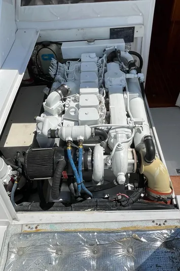 Bushwacker Yacht Photos Pics 1972 Bertram 31 Sedan Hardtop Cruiser engine compartment, showcasing a well-maintained marine engine.