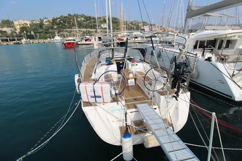 A Yacht Photos Pics 2009 Dufour 425 Grand Large yacht docked in a marina, surrounded by other boats.