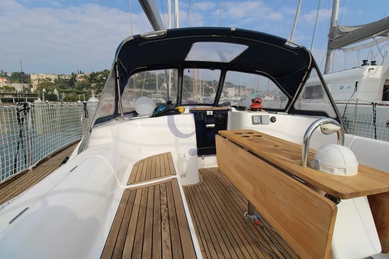 A Yacht Photos Pics 2009 Dufour 425 Grand Large sailboat with teak deck and cockpit, docked in a marina.