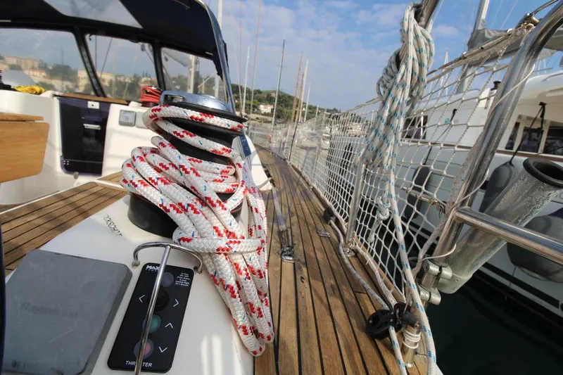 A Yacht Photos Pics 2009 Dufour 425 Grand Large yacht deck with ropes and winch, docked at marina.