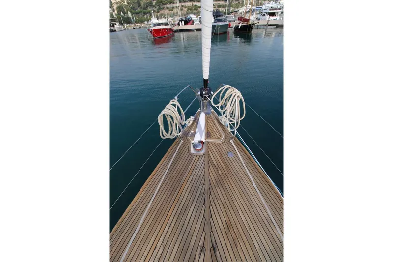 A Yacht Photos Pics Bow of 2009 Dufour 425 Grand Large yacht with teak deck in marina.