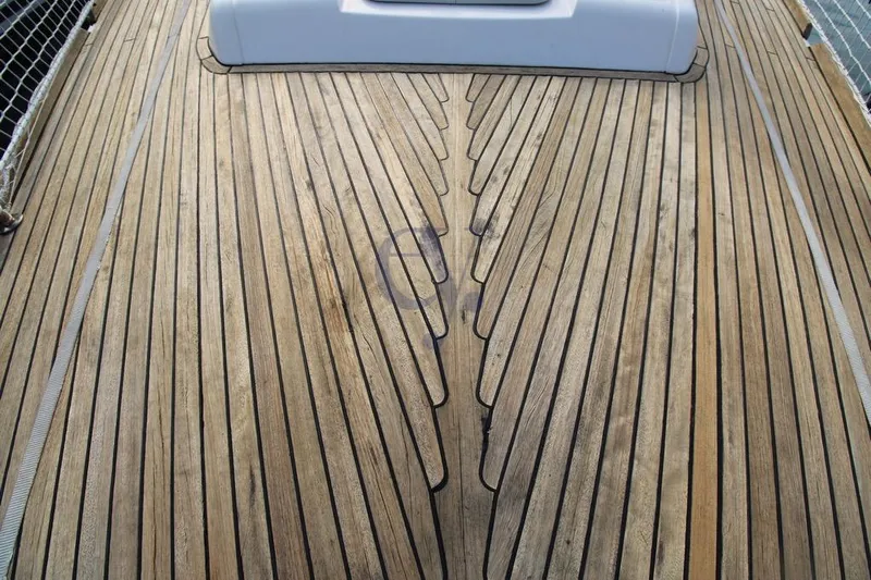 A Yacht Photos Pics Teak deck of 2009 Dufour 425 Grand Large sailboat, showcasing elegant wood pattern.
