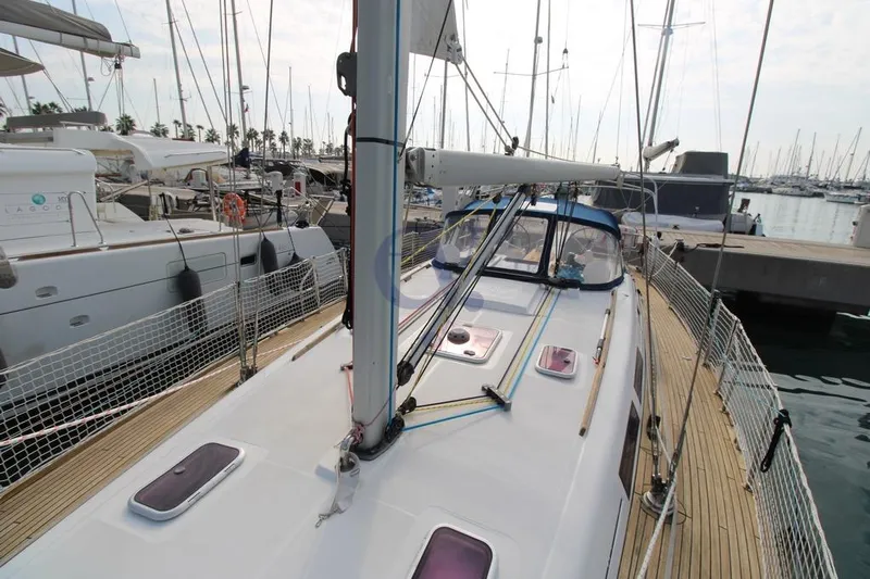 A Yacht Photos Pics 2009 Dufour 425 Grand Large sailboat docked at marina, showcasing deck and rigging.