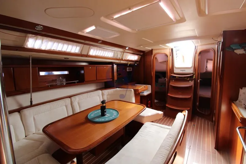 A Yacht Photos Pics Luxurious interior of 2009 Dufour 425 Grand Large yacht with elegant wood finish.