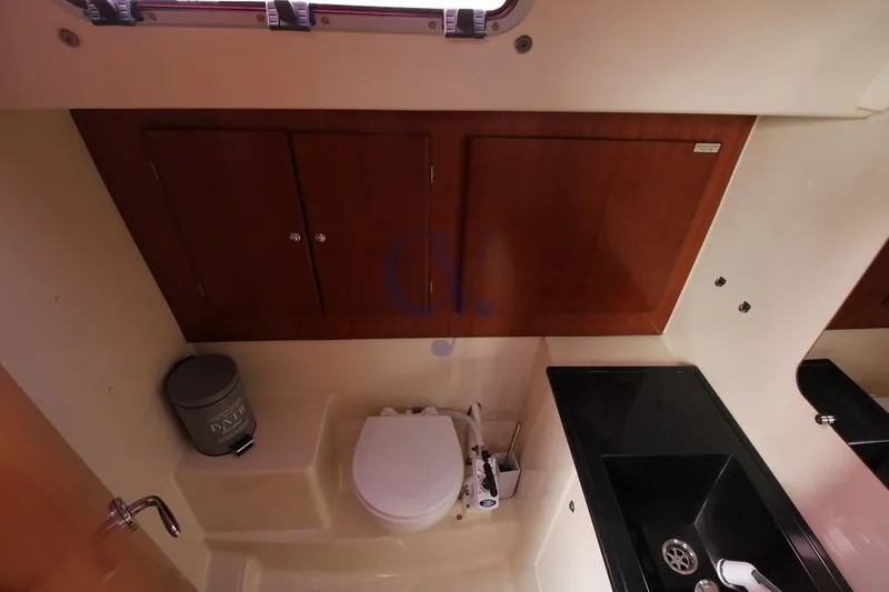A Yacht Photos Pics Bathroom interior of 2009 Dufour 425 Grand Large yacht, featuring toilet and sink.