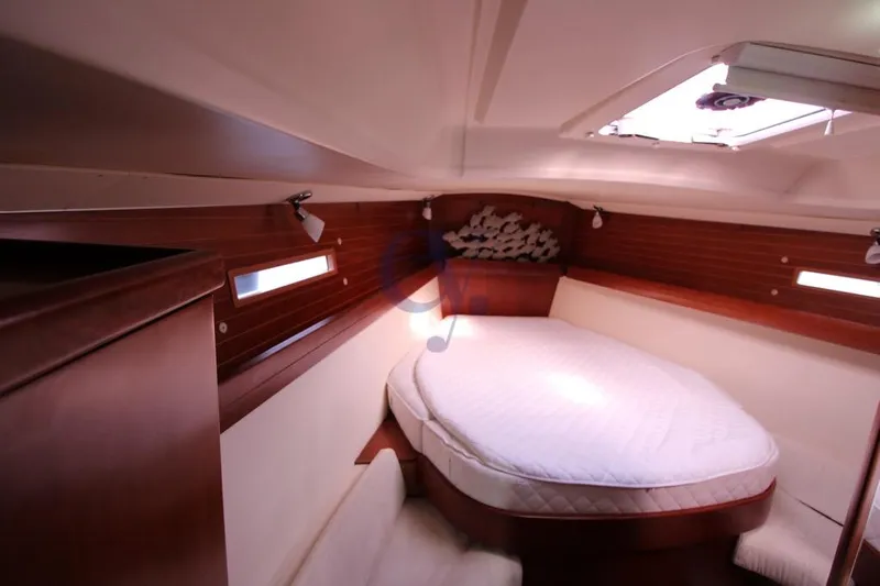 A Yacht Photos Pics Cozy cabin interior of 2009 Dufour 425 Grand Large sailboat with wooden accents.