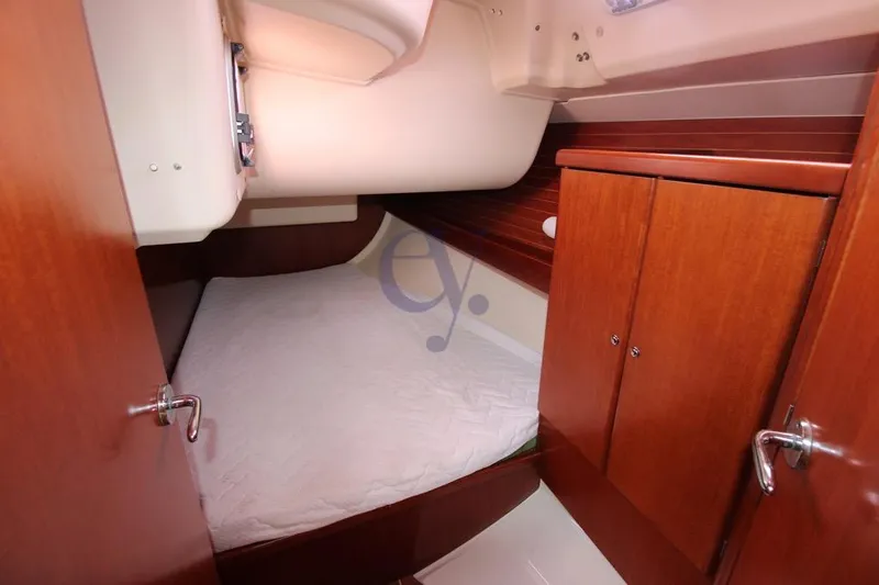 A Yacht Photos Pics Cozy cabin interior of 2009 Dufour 425 Grand Large sailboat with wooden finish.