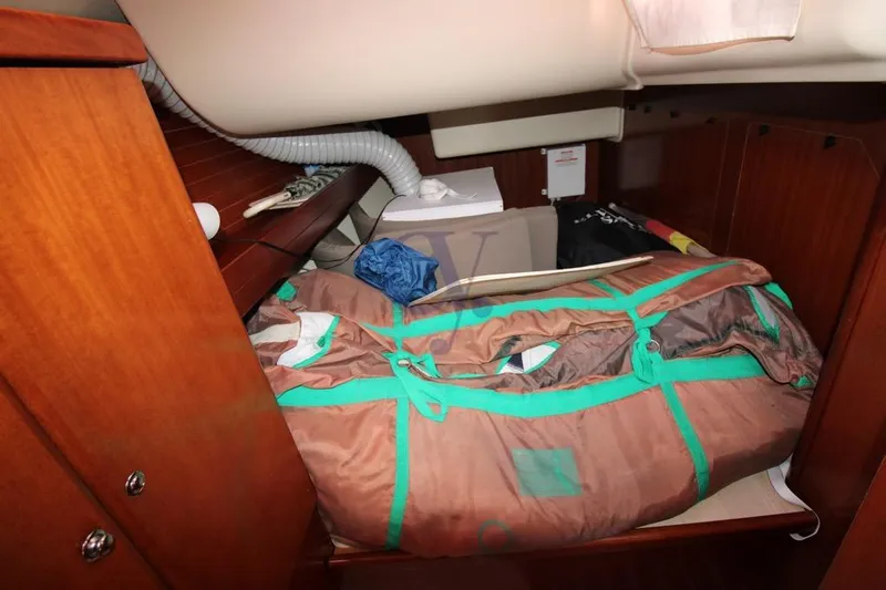 A Yacht Photos Pics Interior cabin storage of 2009 Dufour 425 Grand Large sailboat with packed items.