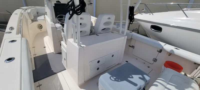  Yacht Photos Pics 2020 Cobia 320 Center Console boat interior with seating and storage compartments.