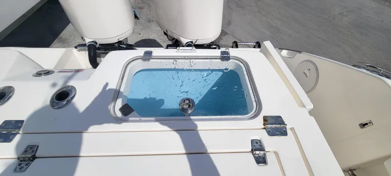  Yacht Photos Pics 2020 Cobia 320 Center Console livewell with water, viewed from above.