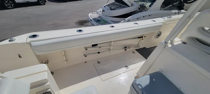  Yacht Photos Pics 2020 Cobia 320 Center Console boat interior with seating and storage compartments.