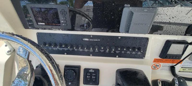  Yacht Photos Pics 2020 Cobia 320 Center Console dashboard with controls and navigation equipment.