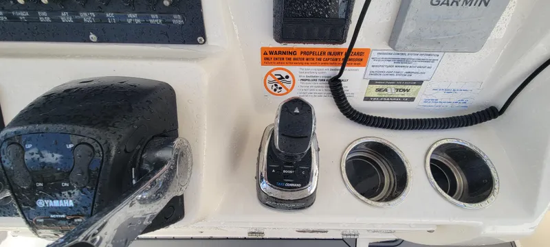  Yacht Photos Pics Control panel of 2020 Cobia 320 Center Console boat with Yamaha throttle and Garmin device.