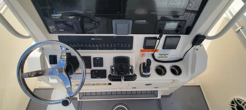  Yacht Photos Pics 2020 Cobia 320 Center Console dashboard with steering wheel and controls.