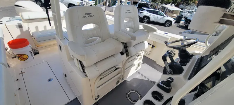  Yacht Photos Pics 2020 Cobia 320 Center Console boat interior with dual captain seats and steering console.
