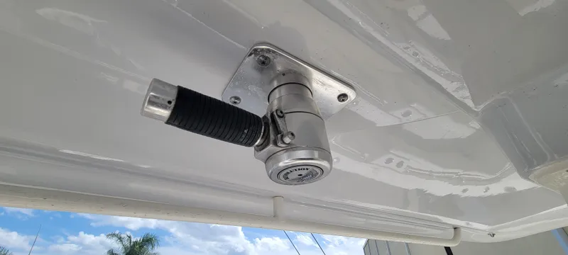  Yacht Photos Pics Close-up of a 2020 Cobia 320 Center Console boat fitting against a blue sky.