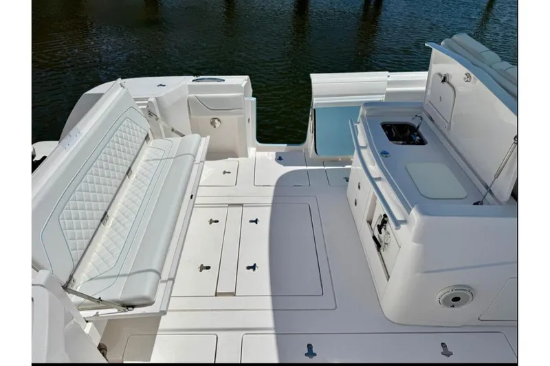 Solete 3 Yacht Photos Pics 2020 Intrepid 375 Nomad FE boat interior with seating and kitchenette.