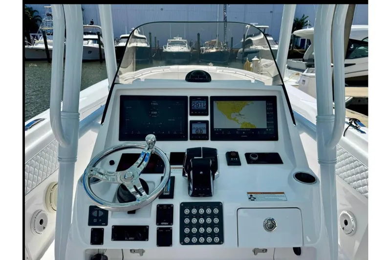 Solete 3 Yacht Photos Pics 2020 Intrepid 375 Nomad FE boat dashboard with navigation screens and controls.