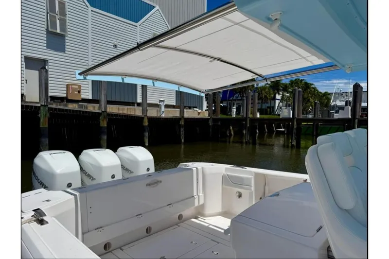 Solete 3 Yacht Photos Pics 2020 Intrepid 375 Nomad FE boat with triple Mercury engines docked at marina.