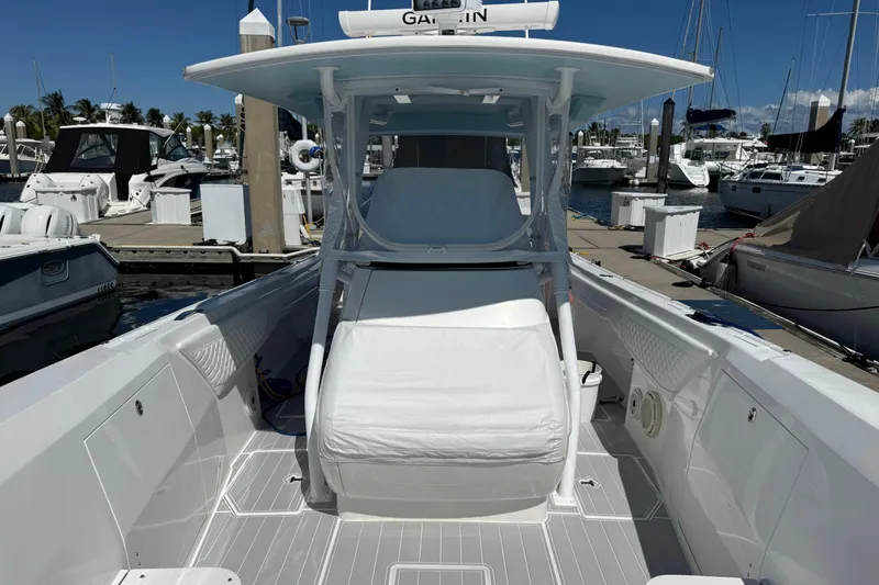 Solete 3 Yacht Photos Pics 2020 Intrepid 375 Nomad FE boat docked at marina, featuring sleek design and spacious deck.