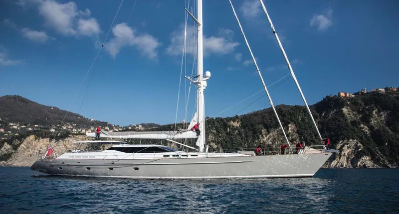 My Star Yacht Photos Pics Luxurious 1994 Alloy Yachts Sloop sailing near scenic coastline under clear blue sky.