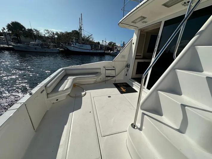  Yacht Photos Pics 1997 Sea Ray 550 Sedan Bridge yacht deck with marina view.