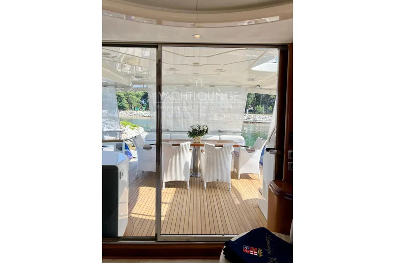  Yacht Photos Pics Luxurious 2004 Azimut 74 Solar yacht deck with elegant seating and scenic view.