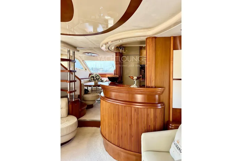  Yacht Photos Pics Luxurious interior of 2004 Azimut 74 Solar yacht with elegant wood finishes and seating.