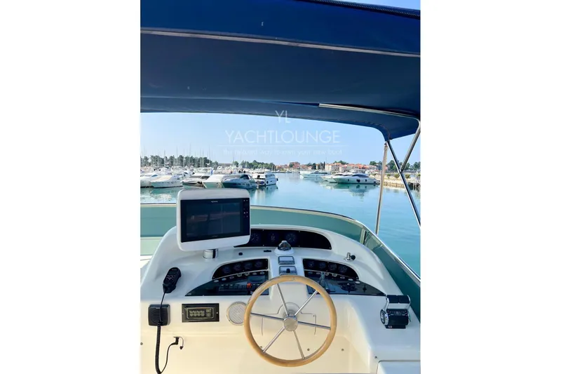  Yacht Photos Pics Cockpit view of 2004 Azimut 74 Solar yacht in marina setting.