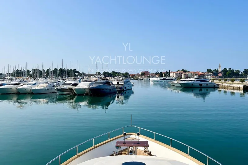  Yacht Photos Pics Yacht marina view with Azimut 74 Solar, 2004 model, under clear blue sky.