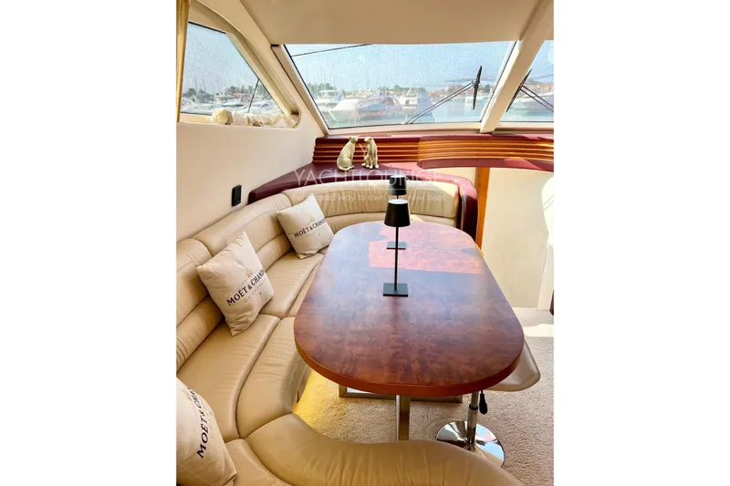  Yacht Photos Pics Luxurious interior of 2004 Azimut 74 Solar yacht with elegant seating and table.