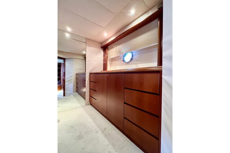  Yacht Photos Pics Luxurious interior of 2004 Azimut 74 Solar yacht with elegant wood cabinetry.