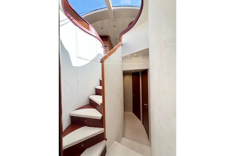  Yacht Photos Pics Interior staircase of 2004 Azimut 74 Solar yacht with skylight and modern design.