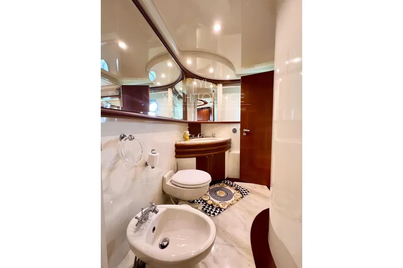  Yacht Photos Pics Luxurious bathroom on 2004 Azimut 74 Solar yacht with elegant fixtures and decor.
