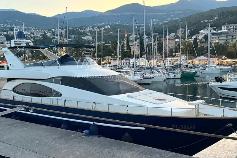  Yacht Photos Pics Luxury 2004 Azimut 74 Solar yacht docked in scenic marina setting.