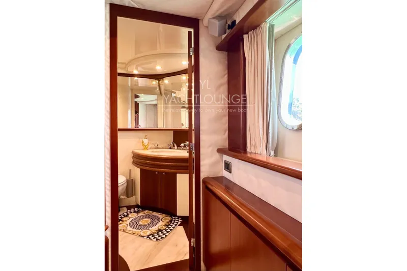  Yacht Photos Pics Luxurious bathroom interior of 2004 Azimut 74 Solar yacht with elegant wood finishes.