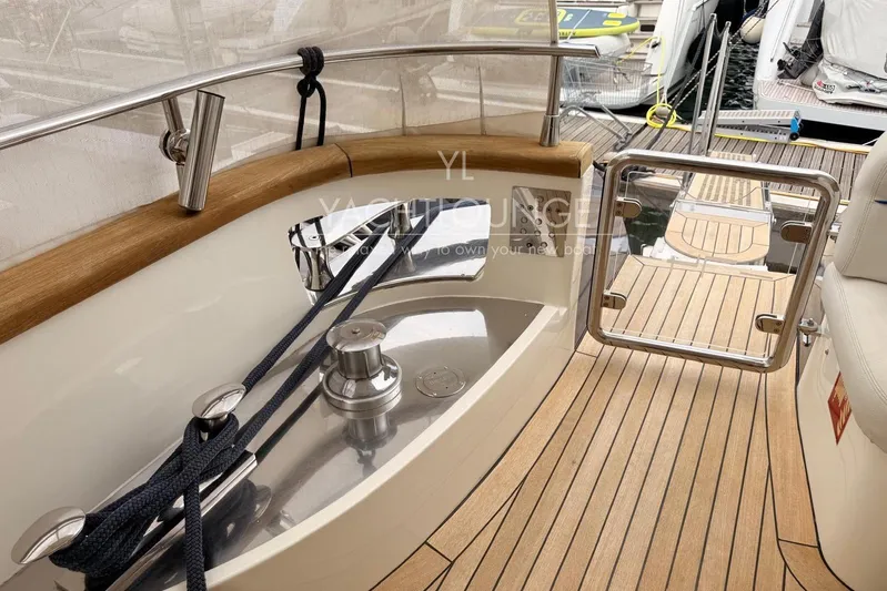  Yacht Photos Pics 2004 Azimut 74 Solar yacht deck with polished wood and stainless steel details.