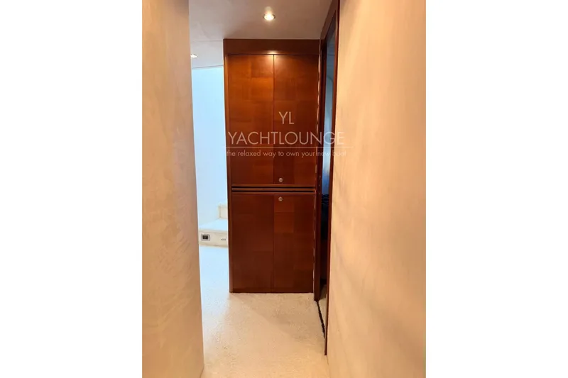  Yacht Photos Pics Hallway inside 2004 Azimut 74 Solar yacht with wooden cabinetry and soft lighting.