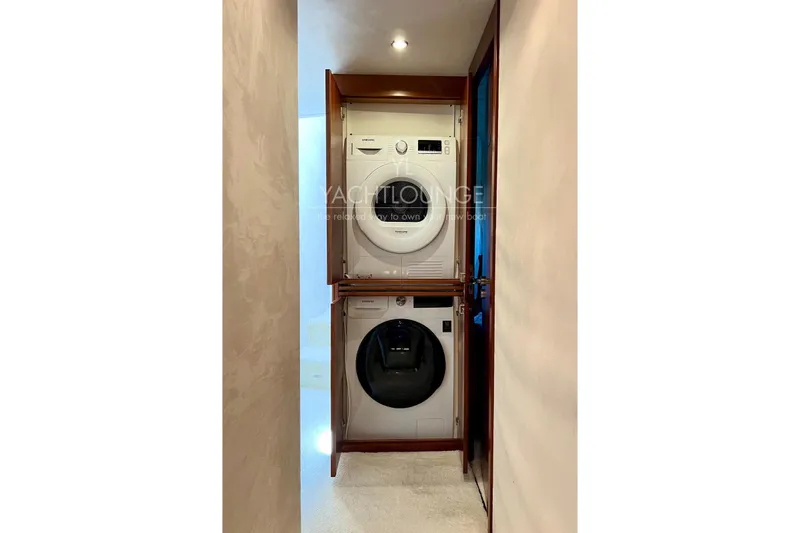  Yacht Photos Pics Stacked washer and dryer in 2004 Azimut 74 Solar yacht interior.