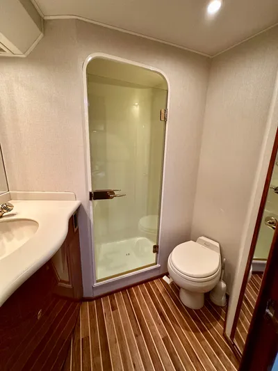 Don't Panic Yacht Photos Pics Bathroom interior of 2004 Viking 56 Convertible SONAR yacht with shower and toilet.