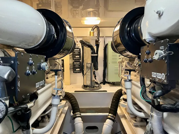 Don't Panic Yacht Photos Pics Engine room of 2004 Viking 56 Convertible SONAR yacht, showcasing mechanical components.