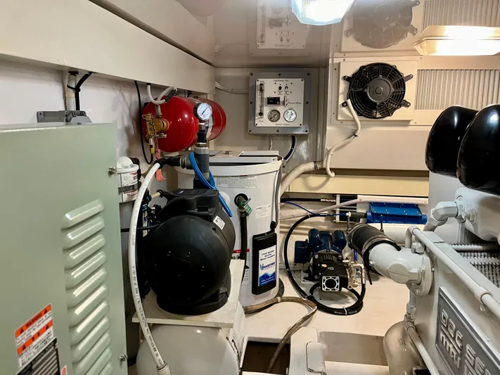 Don't Panic Yacht Photos Pics Engine room of 2004 Viking 56 Convertible SONAR with equipment and controls.