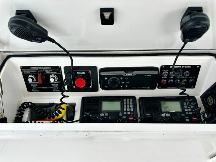 Don't Panic Yacht Photos Pics Control panel of 2004 Viking 56 Convertible SONAR with communication equipment and microphones.