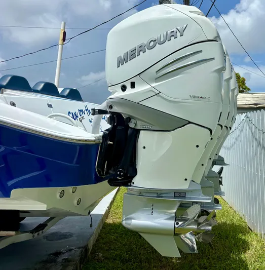  Yacht Photos Pics 2007 Midnight Express 39 Cuddy with Mercury outboard engines, docked on grass.
