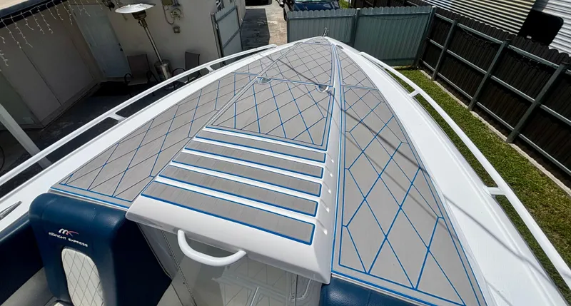  Yacht Photos Pics 2007 Midnight Express 39 Cuddy boat deck with blue diamond pattern design.