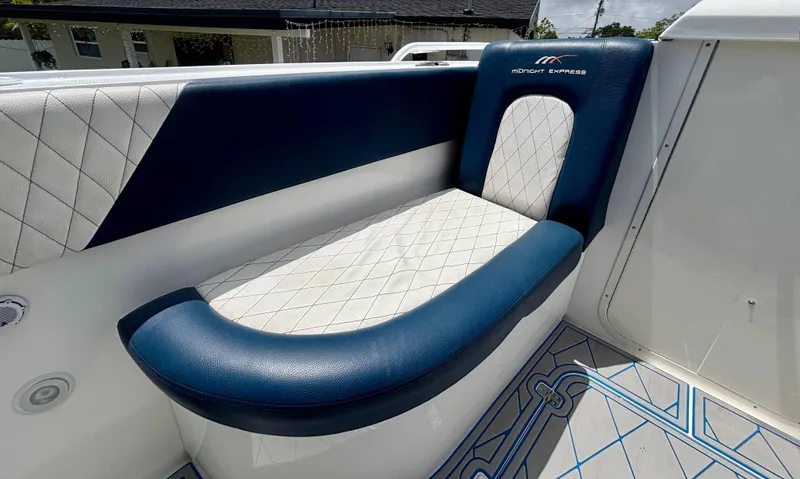  Yacht Photos Pics Luxurious seating on a 2007 Midnight Express 39 Cuddy boat, featuring blue and white upholstery.