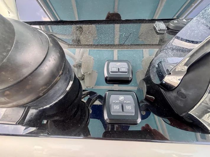  Yacht Photos Pics Control panel of a 2007 Midnight Express 39 Cuddy boat with start/stop buttons.