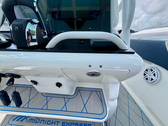  Yacht Photos Pics 2007 Midnight Express 39 Cuddy boat interior with control panel and branded flooring.